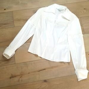 Peter Nygard womens blouse with pearl snaps and pleated accents. Cuffed sleeves